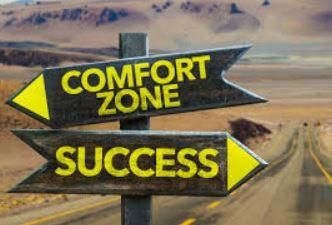 Comfort zone vs success signpost pointing in different directions