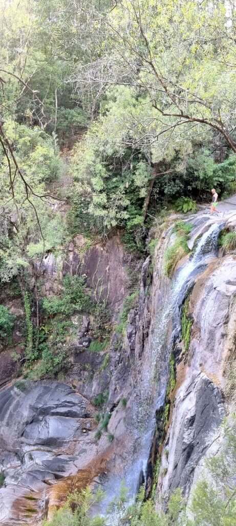 Cascatas de Fecha de Barjas waterfall surrounded by green rocks