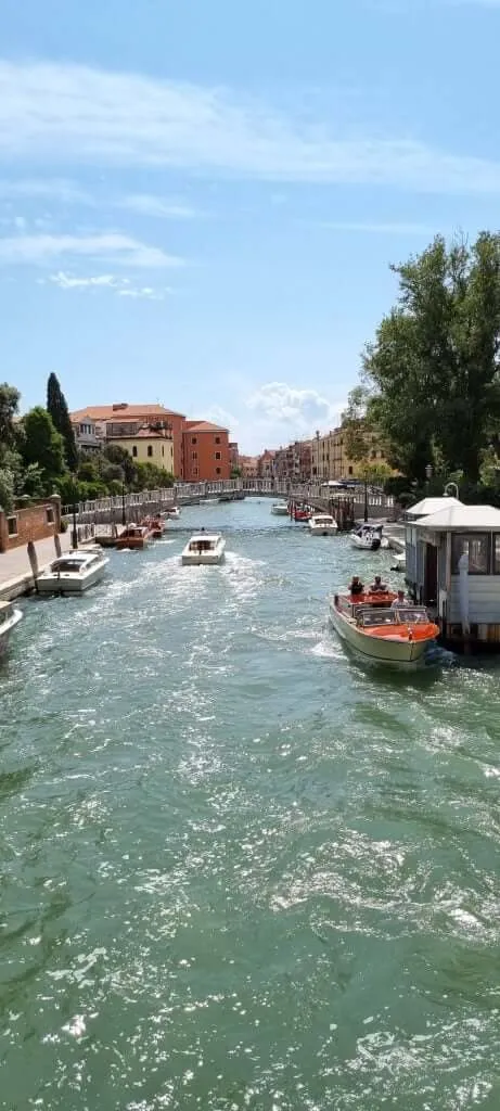 Venice waterway with tourist boats